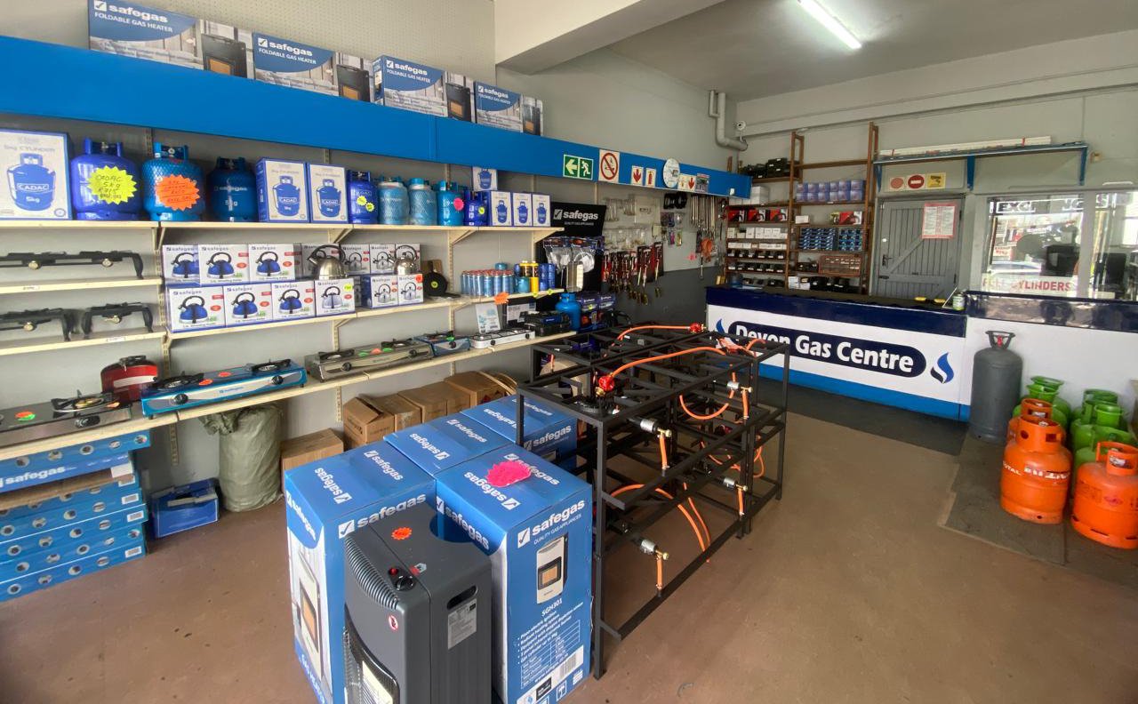 Devon Gas Centre interior showing gas cylinders, stoves, kettles and appliances